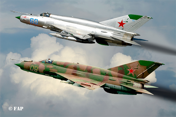 DIGITAL ART   2 Mikoyan-Gurevich MiG 21`s SMT (NATO designation Fishbed K)  the 60 no: N50022121 of 296-iap at Altenburg Nobitz. One of the Soviet Air Force Frontal Aviation Units and they were used primarily in an air-ground role,in the late 1970 & 1980`s.After the Russian have left Germany, a group of aircraft enthousiast have rebuilt this beautiful machine.This  version could be equipt with nucliair bombs.Nikkor 17/55 AF/s 1/2,8G Lens  500-sec F-8 100-Iso.Photoshop 7.0 did made them fly again