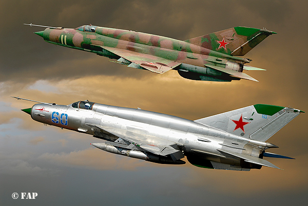 DIGITAL ART   2 Mikoyan-Gurevich MiG 21`s SMT (NATO designation Fishbed K)  the 60 no: N50022121 of 296-iap at Altenburg Nobitz.In the back SMT the 11 One of the Soviet Air Force Frontal Aviation Units and they were used primarily in an air-ground role,in the late 1970 & 1980`s.After the Russian have left Germany, a group of aircraft enthousiast have rebuilt this beautiful machine.This  version could be equipt with nucliair bombs.Nikkor 17/55 AF/s 1/2,8G Lens  500-sec F-8 100-Iso.Photoshop 7.0 did made them fly again
