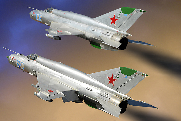 DIGITAL ART!  MiG 21-SMT Fishbed 60 and 06,     2 Mikoyan-Gurevich MiG 21`s SMT (NATO designation Fishbed K)the 60 no: N50022121 of 296-iap at  Altenburg Nobitz. One of the Soviet Air Force Frontal Aviation Units and they were used primarily in  an air-ground role,in the late 1970 & 1980`s.After the Russian have left Germany, a group of aircraft  enthousiast have rebuilt this beautiful machine.This  version could be equipt with nucliair  bombs.Nikkor 17/55 AF/s 1/2,8G Lens  500-sec F-8 100-Iso.Photoshop 7.0 did made them fly again.