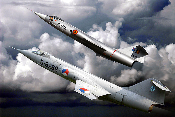 DIGITAL ART  2 F-104-G Starfighters in formation the D-8268 in 322-Sqd colours of the Dutch AF, now at display at a comprehensive school in Zwolle Netherlands. and the FX-94 of 10-Wing Belgian AF, now at display near its home base Kleinbrogel Belgium. Nikkor 17/35 AF/s 1/2,8G Lens  1/500-sec F-7,1 100-Iso focal lenght 55-mm. Photoshop 7,0 did them fly again!!