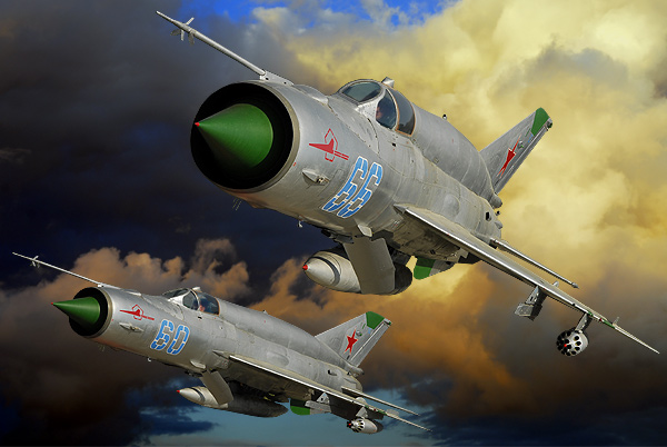 DIGITAL ART   2 Mikoyan-Gurevich MiG 21`s SMT (NATO designation Fishbed K)  the 60 no: N50022121 of 296-iap at Altenburg Nobitz. One of the Soviet Air Force Frontal Aviation Units and they were used primarily in an air-ground role,in the late 1970 & 1980`s.After the Russian have left Germany, a group of aircraft enthousiast have rebuilt this beautiful machine.This  version could be equipt with nucliair bombs.Nikkor 17/55 AF/s 1/2,8G Lens  500-sec F-8 100-Iso.Photoshop 7.0 did made them fly again